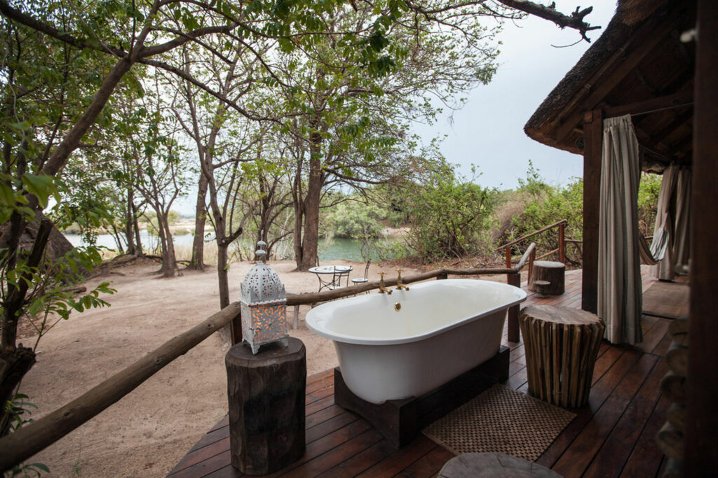 Image of the outdoor bathtub of the Honeymoon Chalet overlooking the Zambezi River at Sindabezi Island Camp in Zambia | Planet Africa/TrueAfrica Safaris | Blog | Green Safaris: Sidabezi Island Camp